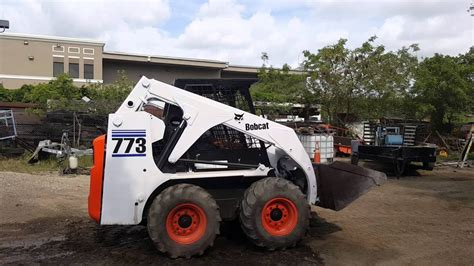 773 f skid steer tilt wont unlock|773f interlock won't release.